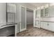 Office with a white built-in cabinet, granite countertops, wood flooring, and glass french doors at 22944 E Via Del Oro --, Queen Creek, AZ 85142