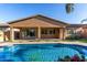 Stunning backyard pool and patio area, perfect for outdoor entertaining with artificial grass at 22944 E Via Del Oro --, Queen Creek, AZ 85142