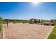 Well-maintained sand volleyball court with net and nearby seating within the community at 22944 E Via Del Oro --, Queen Creek, AZ 85142