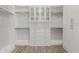 Bright walk-in closet with built-in cabinets and ample hanging space for your wardrobe at 22944 E Via Del Oro --, Queen Creek, AZ 85142