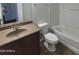 Bathroom featuring a sink, vanity, toilet, and shower-tub combo at 2323 E Huntington Dr, Phoenix, AZ 85040