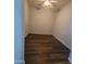 Empty room with natural light, ceiling fan, and hard wood flooring at 2323 E Huntington Dr, Phoenix, AZ 85040