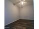 Bedroom featuring modern wood-look floors, light grey walls and a ceiling fan at 2323 E Huntington Dr, Phoenix, AZ 85040