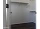 Walk-in closet featuring wood-look floors, white walls and shelves at 2323 E Huntington Dr, Phoenix, AZ 85040