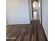 Hallway with wood-look floors leads to the upper level of the home at 2323 E Huntington Dr, Phoenix, AZ 85040