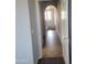 Hallway with tiled floor leading to a staircase with pendant lighting at 2323 E Huntington Dr, Phoenix, AZ 85040
