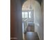 Hallway view leading to staircase and pendant lighting fixtures at 2323 E Huntington Dr, Phoenix, AZ 85040