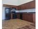 Functional kitchen with appliances, ample cabinet space, and dark countertops at 2323 E Huntington Dr, Phoenix, AZ 85040