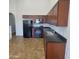 Bright kitchen with appliances and dark countertop and ample cabinet space at 2323 E Huntington Dr, Phoenix, AZ 85040