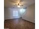 Bright and spacious living room with tiled floors, ceiling fan, and staircase at 2323 E Huntington Dr, Phoenix, AZ 85040