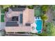 Drone shot of a home featuring a pool, putting green, solar panels, and lush landscaping at 26036 N 85Th Dr, Peoria, AZ 85383