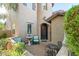 Charming front entrance with a cozy seating area, fountain, and lush landscaping creating a welcoming ambiance at 26036 N 85Th Dr, Peoria, AZ 85383
