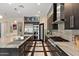 Well-equipped kitchen featuring marble countertops, stainless steel appliances, and modern cabinetry at 26036 N 85Th Dr, Peoria, AZ 85383