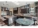 Spacious kitchen boasts marble countertops, stainless steel appliances, and an island with seating at 26036 N 85Th Dr, Peoria, AZ 85383
