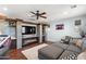 Living room with built-in media center, a fireplace, and a large sectional sofa at 26036 N 85Th Dr, Peoria, AZ 85383