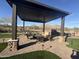 Relaxing covered patio with ample seating, ideal for outdoor entertaining and enjoying the view at 26036 N 85Th Dr, Peoria, AZ 85383