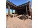 Elegant outdoor dining area with pergola, featuring comfortable seating and a sophisticated ambiance at 26036 N 85Th Dr, Peoria, AZ 85383