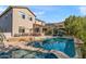 Luxury home with a backyard pool and a patio featuring seating and fire pit at 26036 N 85Th Dr, Peoria, AZ 85383