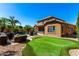 Expansive backyard featuring a pool, spa, putting green and tropical landscaping at 2759 E Balsam Dr, Chandler, AZ 85286