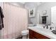 Well-lit bathroom featuring a classic vanity, tub, and neutral decor at 2759 E Balsam Dr, Chandler, AZ 85286