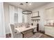 Elegant dining area with stylish chandelier, seating and built in bar at 2759 E Balsam Dr, Chandler, AZ 85286