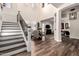 Open-concept home featuring wood-look floors, a staircase, and views into the dining and living areas at 2759 E Balsam Dr, Chandler, AZ 85286