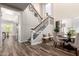 Bright foyer features staircase with wooden banister, trimwork, a dining table and decorative details at 2759 E Balsam Dr, Chandler, AZ 85286