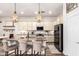 Beautiful kitchen with granite island, pendant lighting and white cabinets at 2759 E Balsam Dr, Chandler, AZ 85286
