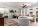 Inviting living room with large sectional sofa, decorative pillows, and a ceiling fan at 2759 E Balsam Dr, Chandler, AZ 85286