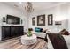 Stylish living room with modern decor, wood-look flooring, and a comfortable seating arrangement at 2759 E Balsam Dr, Chandler, AZ 85286
