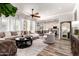 Open-concept living room flows to kitchen; features a large sectional and stylish decor at 2759 E Balsam Dr, Chandler, AZ 85286