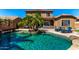 Backyard pool featuring tropical landscaping, lounge chairs, and inviting patio at 2759 E Balsam Dr, Chandler, AZ 85286