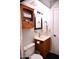 Practical bathroom featuring wooden cabinet, toilet, mirror and towel bar at 286 W Palomino Dr # 78, Chandler, AZ 85225