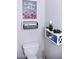 Charming half bathroom featuring unique decorations and a modern toilet at 286 W Palomino Dr # 78, Chandler, AZ 85225
