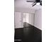 Bedroom featuring dark wood floor, ceiling fan, and mirrored closet doors at 286 W Palomino Dr # 78, Chandler, AZ 85225