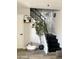 Stylish entryway featuring a staircase with sleek black railings, modern decor, and wood-look flooring at 286 W Palomino Dr # 78, Chandler, AZ 85225