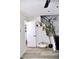 Hallway with art leading to the staircase and bathroom at 286 W Palomino Dr # 78, Chandler, AZ 85225