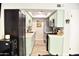 Light, bright kitchen with light green cabinets and stainless steel appliances at 286 W Palomino Dr # 78, Chandler, AZ 85225