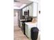 Clean kitchen area featuring light green cabinets and stainless steel appliances at 286 W Palomino Dr # 78, Chandler, AZ 85225