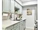 Charming kitchen featuring stainless steel appliances and light green cabinetry at 286 W Palomino Dr # 78, Chandler, AZ 85225