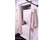 A convenient stacked washer and dryer in the laundry area, maximizing space with a nearby towel and curtain at 286 W Palomino Dr # 78, Chandler, AZ 85225