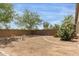 Spacious backyard with desert landscaping, providing privacy and a peaceful outdoor area at 29151 N Lilly Ln, San Tan Valley, AZ 85143