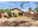 Cozy backyard with desert landscaping, small patio, and seating area, perfect for outdoor relaxation and entertaining at 29151 N Lilly Ln, San Tan Valley, AZ 85143