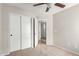 Bedroom features a ceiling fan, closet and access to en-suite bath at 29151 N Lilly Ln, San Tan Valley, AZ 85143