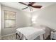 Cozy bedroom with window view, carpet and side table perfect for a guest at 29151 N Lilly Ln, San Tan Valley, AZ 85143