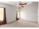 Neutral bedroom with a ceiling fan, and plush carpet; perfect for relaxation at 29151 N Lilly Ln, San Tan Valley, AZ 85143