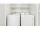 Clean and functional laundry area with side-by-side washer and dryer at 29151 N Lilly Ln, San Tan Valley, AZ 85143
