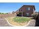 Large backyard featuring a low-maintenance landscape, gravel, partial grass, and covered patio at 2934 W Peggy Dr, San Tan Valley, AZ 85144