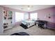 Comfortable bedroom featuring lilac walls, carpet, ceiling fan, window with blinds, desk, and shelving at 2934 W Peggy Dr, San Tan Valley, AZ 85144