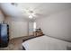 This is a bedroom with a pet enclosure, ceiling fan, and a neutral color palette at 2934 W Peggy Dr, San Tan Valley, AZ 85144
